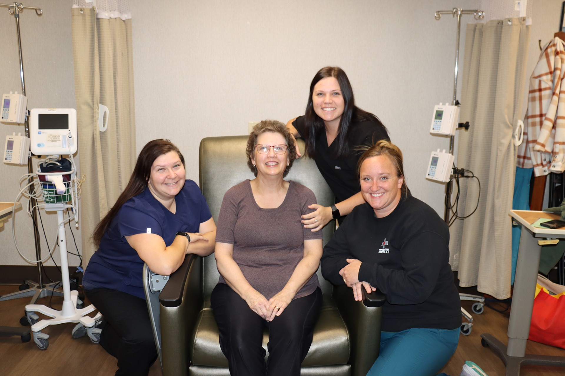 Veterans Memorial Hospital staff members with a patient.